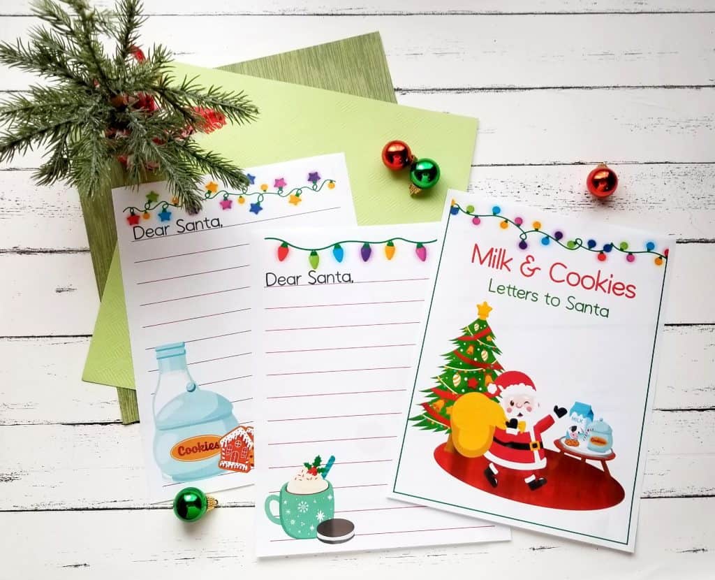 three blank letter to santa tempaltes with cookies and milk clipart in a flat lay