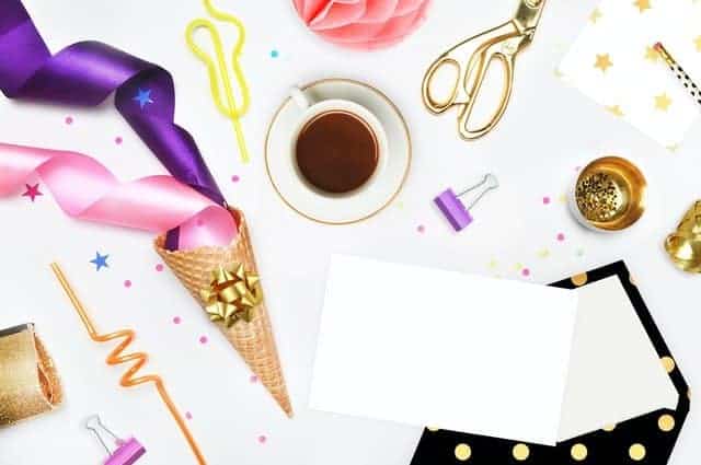 flat lay image with party decorations and coffee shot from above