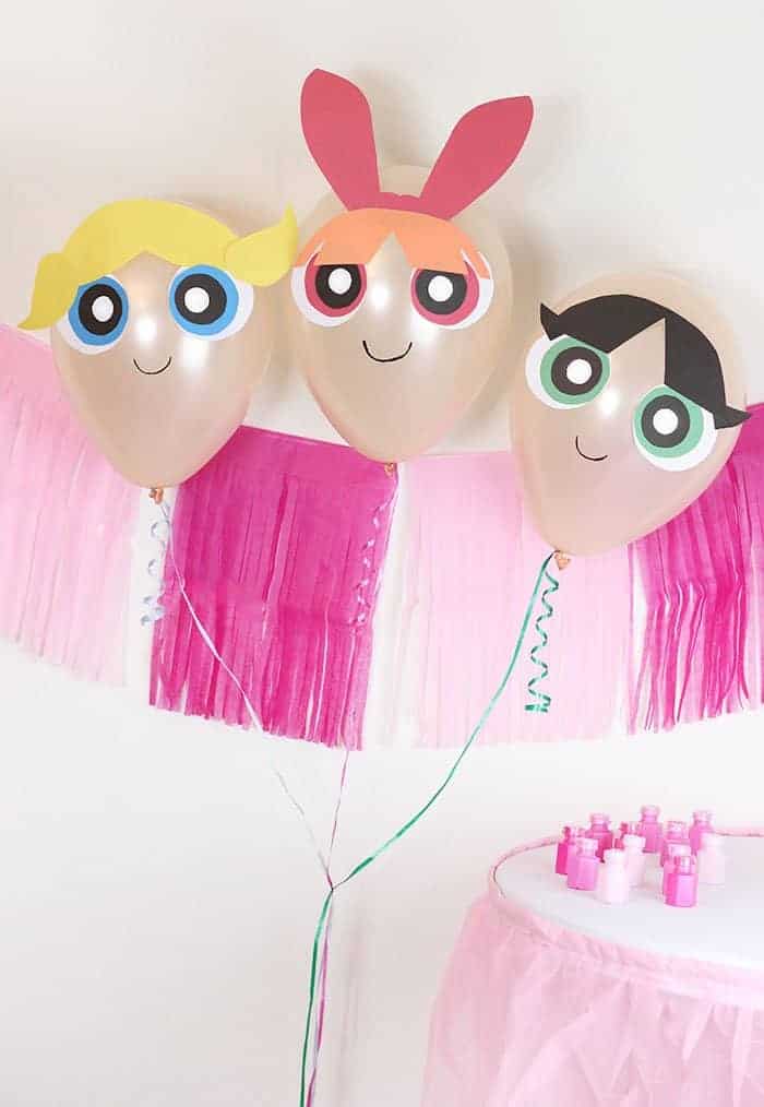 DIY powder puff girls balloons inflated at a party