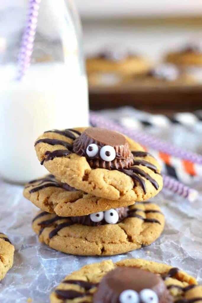 spider cookies stacked with bottle of milk