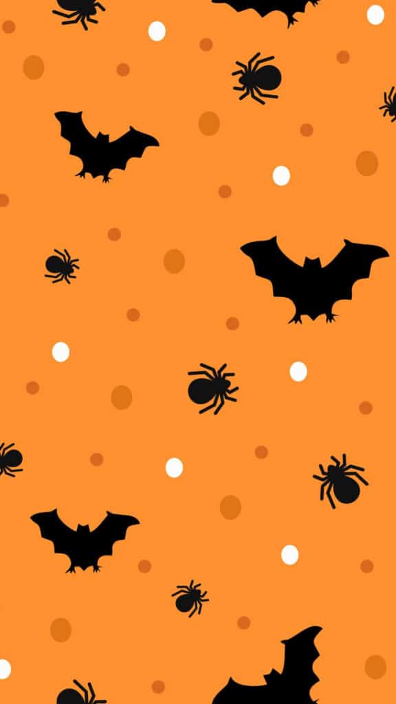halloween wallpaper background image consisting of black bats and spiders with polka dots