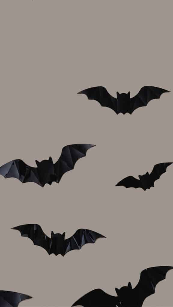 halloween wallpaper background image consisting of black bats on gray backdrop